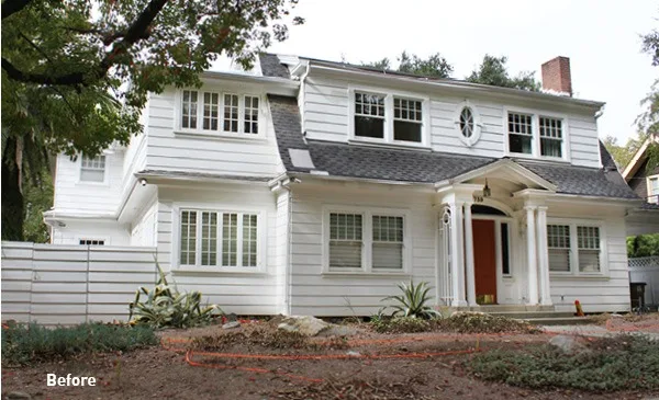 Pitzer Project by HartmanBaldwin - Hartman Baldwin Before exterior image of house with white walls and red door.