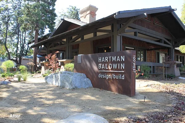 Excellence in Design House Exterior After - Hartman Baldwin After image of exterior of house featuring a HartmanBaldwin sign.