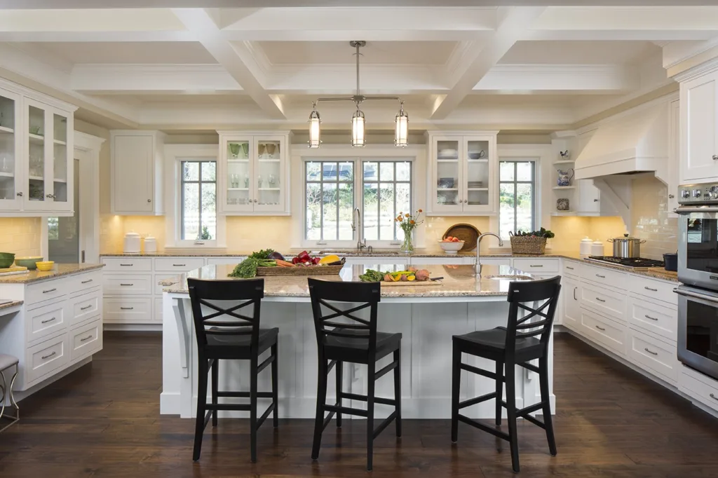 Large kitchen with island and chairs in rebuilding