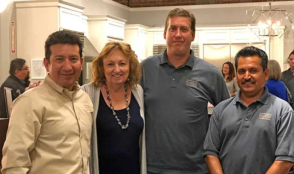 HartmanBaldwin staff and potential clients in showroom.
