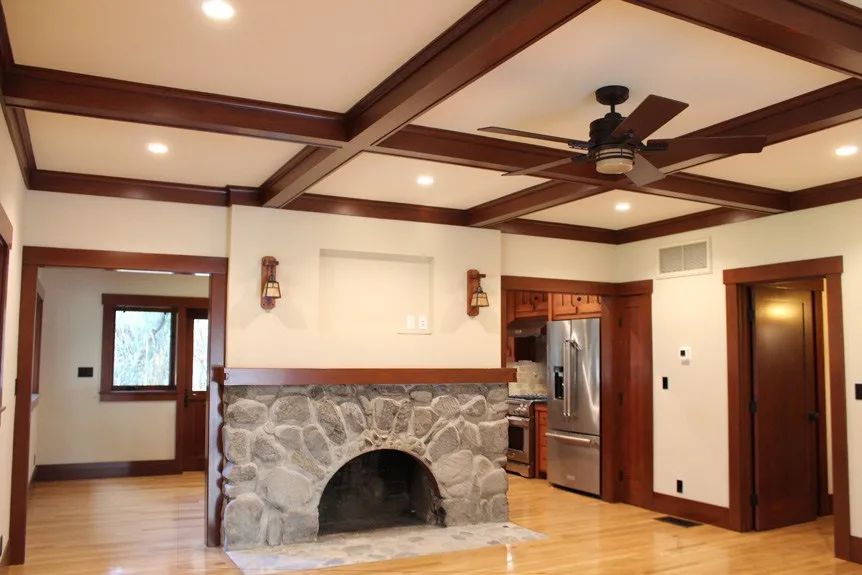 Canyon Residence After Fireplace - Hartman Baldwin After image of Canyon residence's fireplace and new living space. Exposed beams and wood floors.