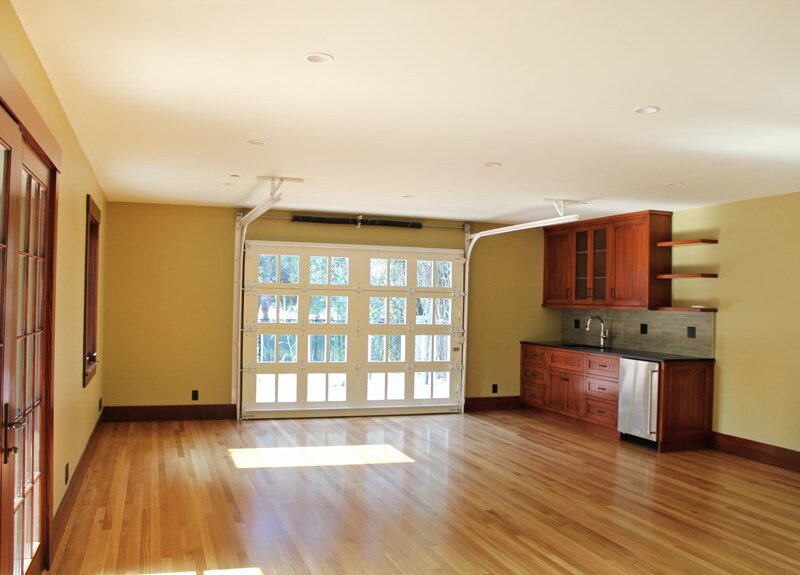 After image of the Canyon residence's interior living space. Hardwood floors, wood bar.