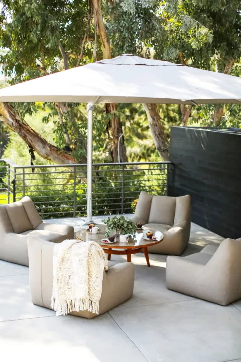 HartmanBaldwin San Rafael Residence Balcony Patio - Hartman Baldwin Balcony patio dining set with large umbrella and large tree