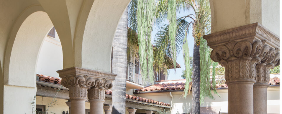 Mediterranean-style arched loggia and courtyard