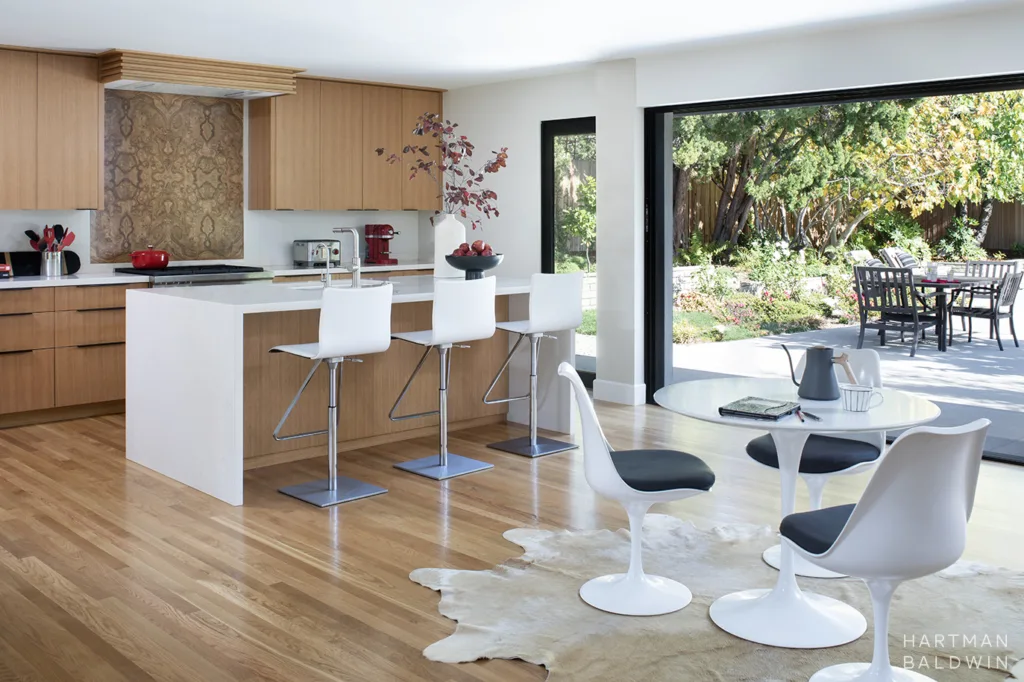 HartmanBaldwin Oak Knoll Residence Mid-Century Modern Kitchen Dining Nook and Sliding Glass Door - Hartman Baldwin Extensive Mid-Century Modern home reconfiguration and remodel with new kitchen and large sliding glass door to backyard