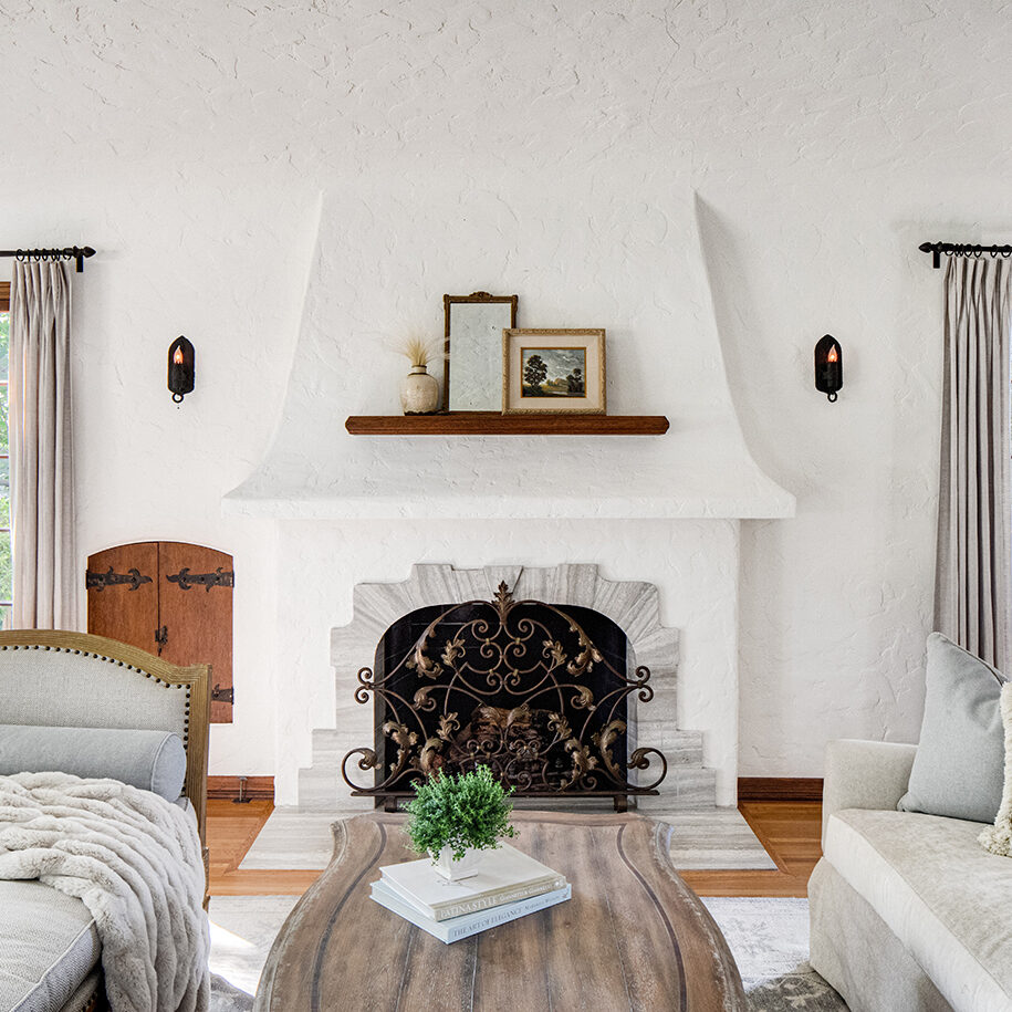 All white stucco style fireplace