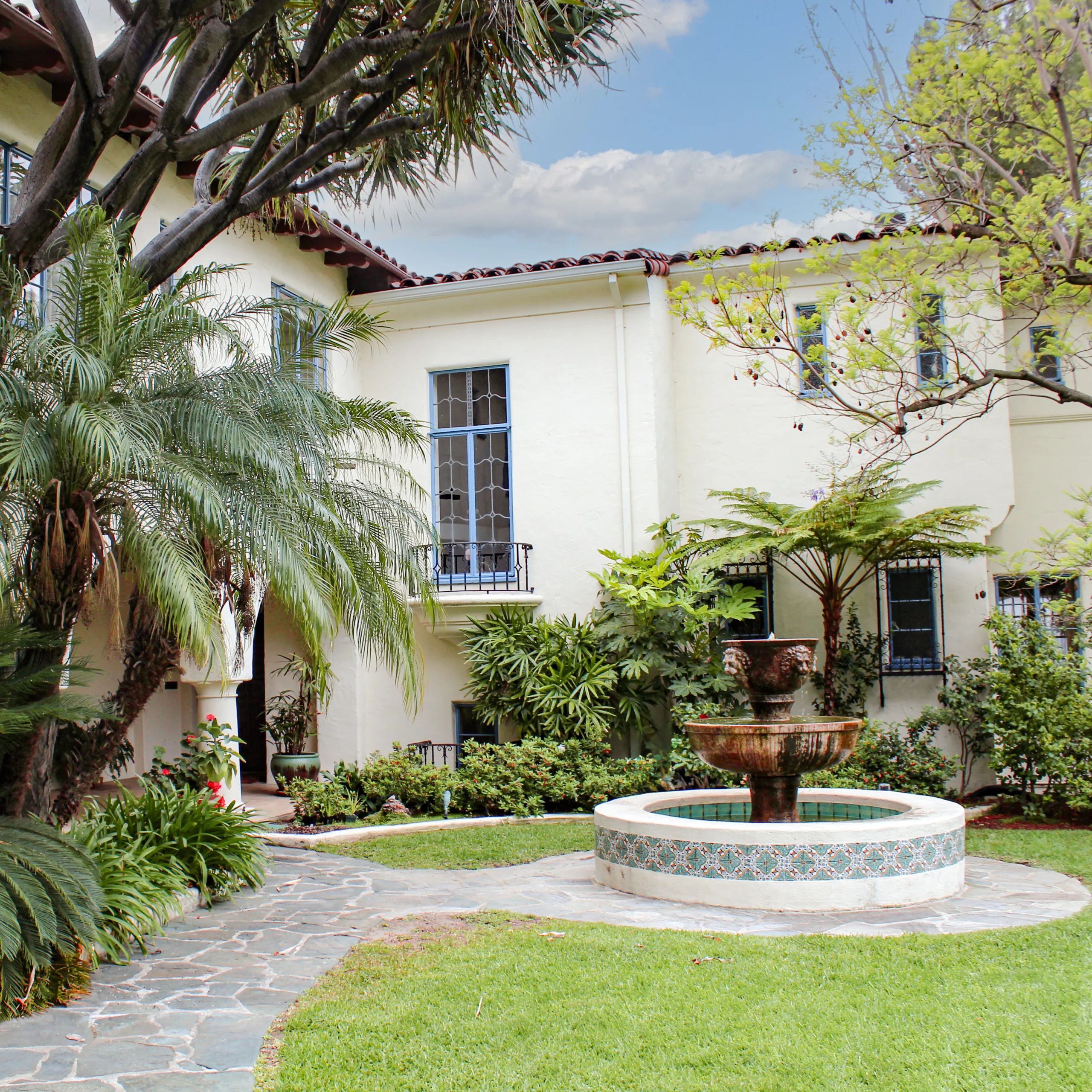 Spanish-style home and courtyard with water fountain