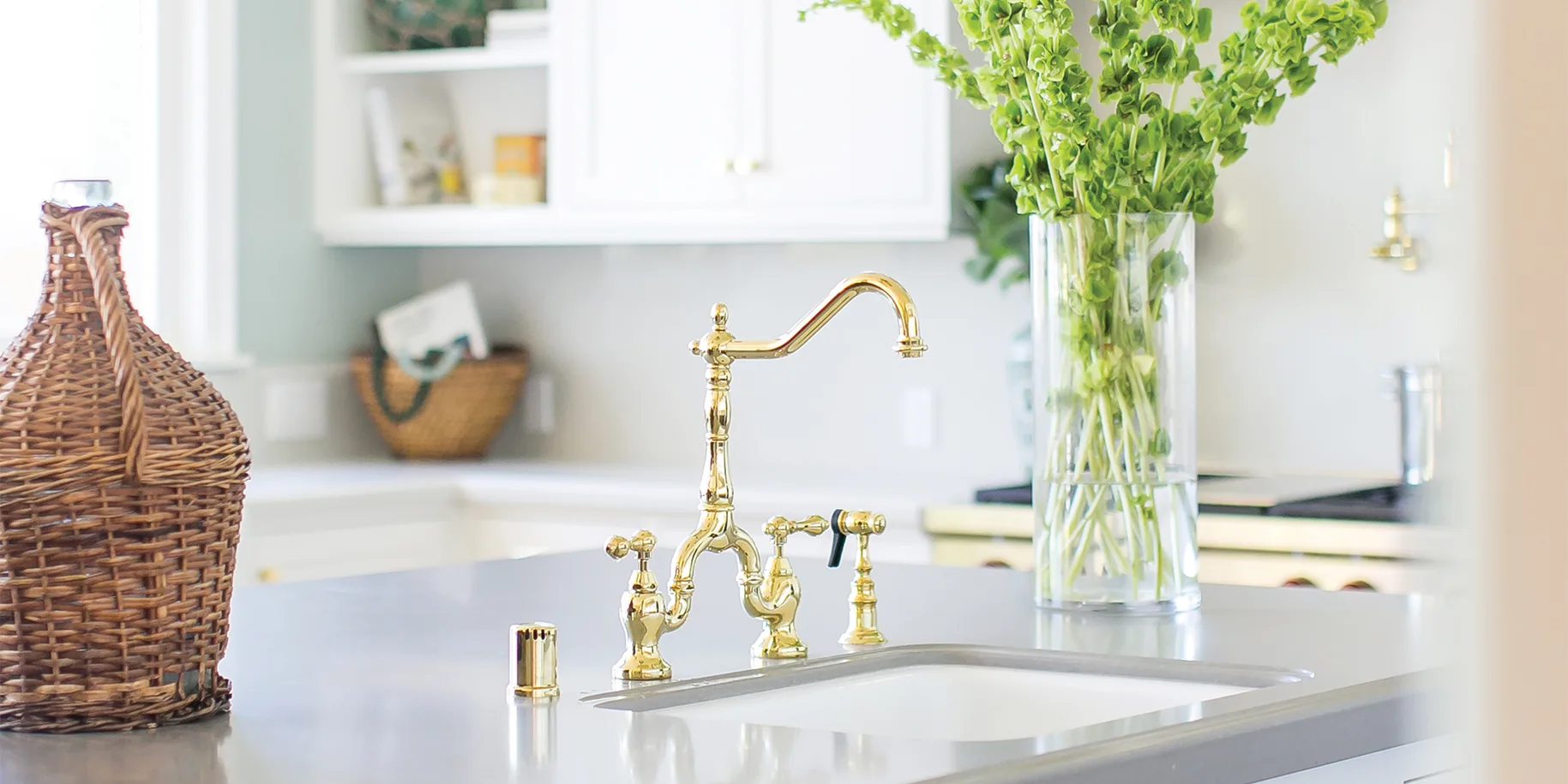 HartmanBaldwin Sugar Pine Residence Kitchen Sink Detail - Hartman Baldwin Kitchen sink with elegant brass faucet in a remodeled coastal kitchen