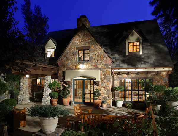 HartmanBaldwin Pomello Residence English Tudor Home Dusk Remodeled English Tudor-style estate exterior at dust