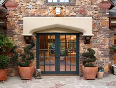 HartmanBaldwin Pomello Residence Guest House Front Room - Hartman Baldwin French door front entrance of English Tudor-style ADU guest house