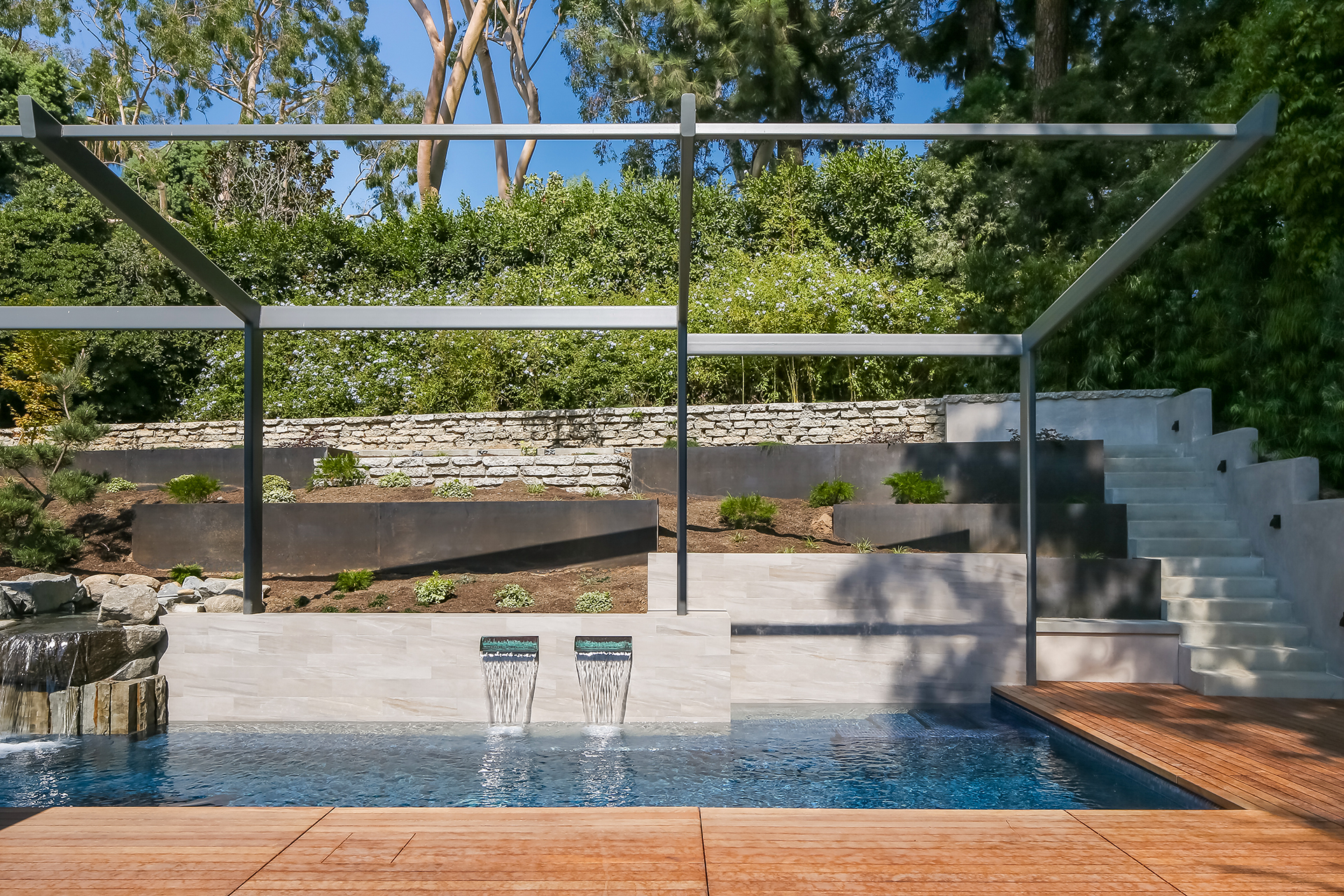 Modern new custom deck, lap pool with waterfalls, and terrace garden in Southern California
